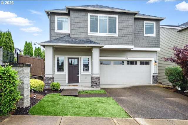 7698 NW Catalpa St, Portland, OR 97229 - view of front of home featuring driveway, an attached garage, stone siding, and a shingled roof