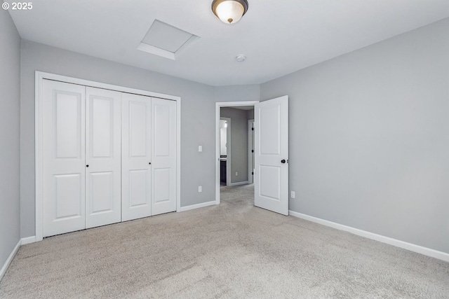 7698 NW Catalpa St, Portland, OR 97229 - unfurnished bedroom featuring carpet, attic access, baseboards, and a closet