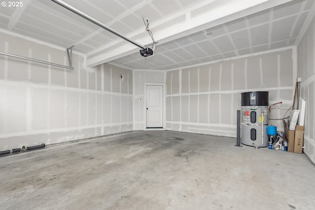 7698 NW Catalpa St, Portland, OR 97229 - garage featuring hybrid water heater and a garage door opener