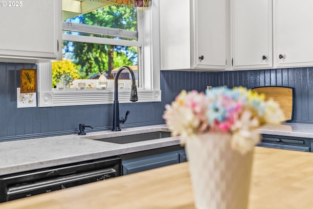 3131 Alyndale Dr, Eugene, OR 97404 - kitchen featuring a sink, dishwasher, light countertops, and white cabinets