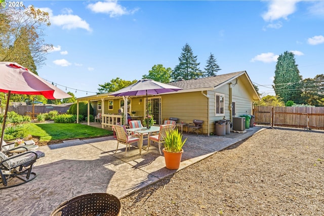 back of property with a patio and cooling unit
