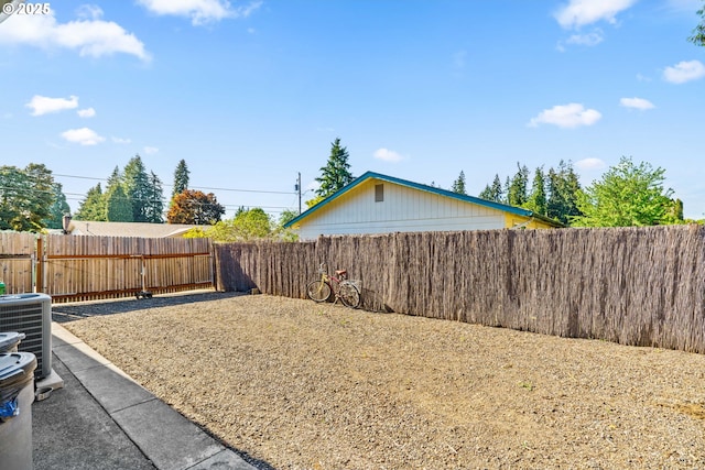 fenced backyard featuring cooling unit
