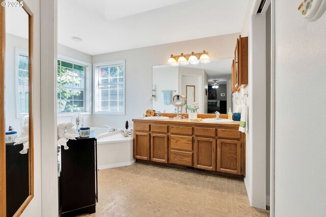 10903 NW 5th Ave, Vancouver, WA 98685 - ensuite bathroom featuring a bath, double vanity, and tile patterned floors