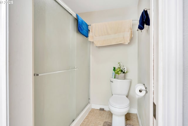10903 NW 5th Ave, Vancouver, WA 98685 - bathroom featuring baseboards, a stall shower, and toilet
