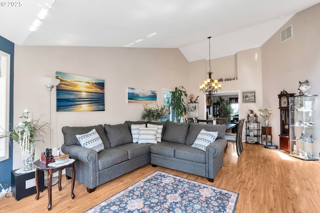 10903 NW 5th Ave, Vancouver, WA 98685 - living area with a chandelier, light wood finished floors, and high vaulted ceiling