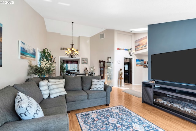 10903 NW 5th Ave, Vancouver, WA 98685 - living room with a chandelier, high vaulted ceiling, and light wood finished floors