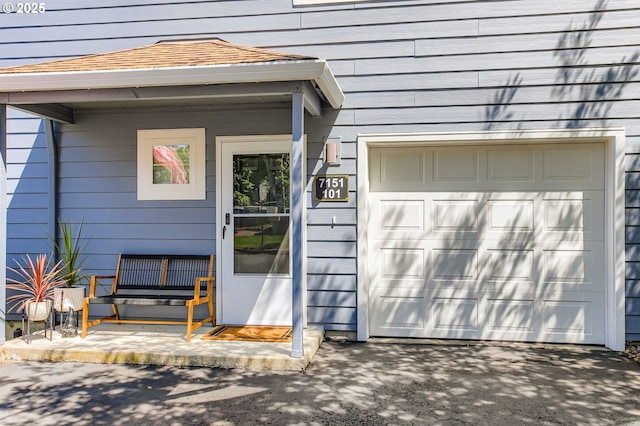 7151 SW Sagert St Unit 101, Tualatin, OR 97062 - view of exterior entry with a garage