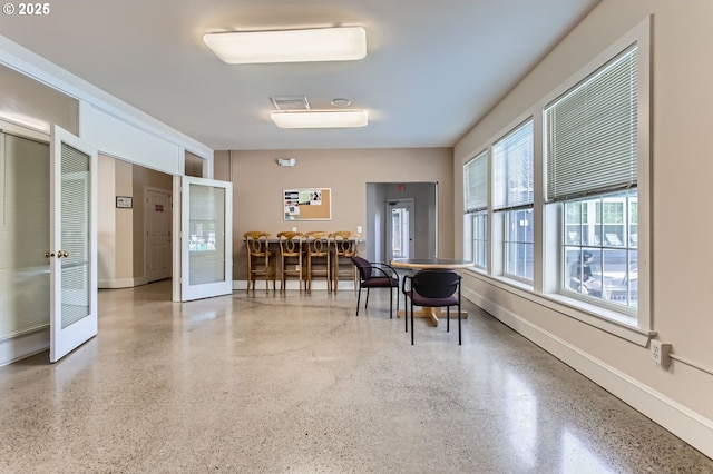 7151 SW Sagert St Unit 101, Tualatin, OR 97062 - dining space featuring speckled floor and baseboards
