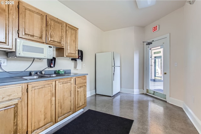 7151 SW Sagert St Unit 101, Tualatin, OR 97062 - kitchen featuring white appliances and concrete floors