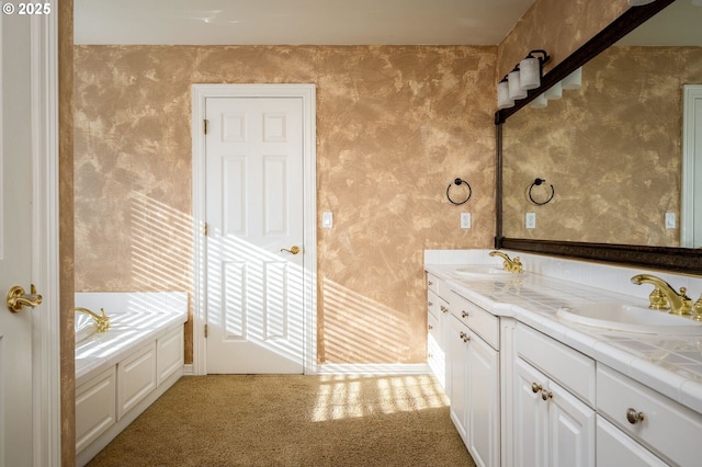 bathroom featuring double vanity, a sink, a bath, and wallpapered walls