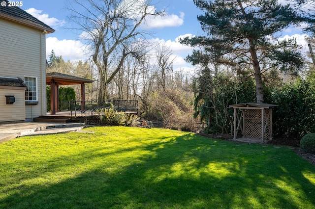 view of yard featuring a deck