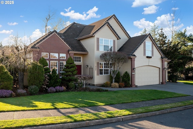 traditional-style home featuring driveway, brick siding, a front lawn, and an attached garage