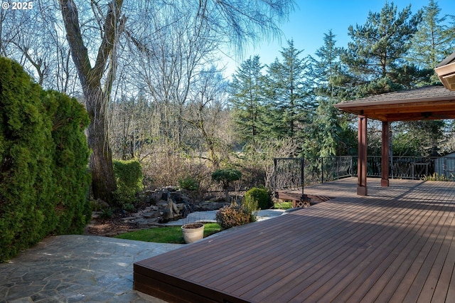 wooden deck with a patio area