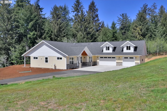 83594 Sauter Dr, Florence, OR 97439 - view of front of house featuring asphalt driveway, stone siding, and a front lawn