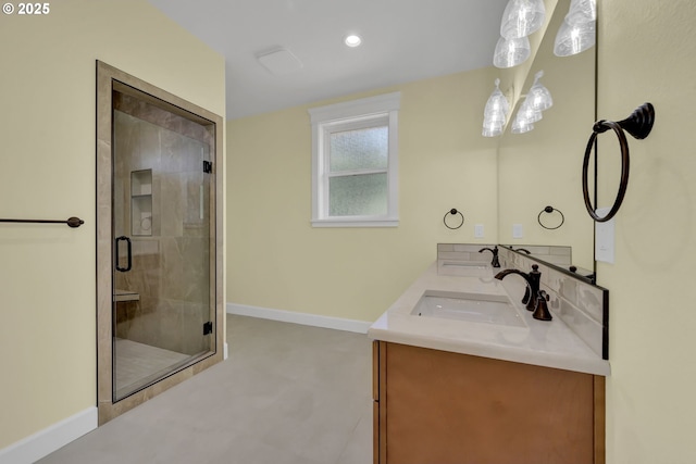 83594 Sauter Dr, Florence, OR 97439 - full bath with a shower stall, baseboards, double vanity, and recessed lighting