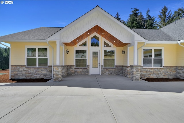 83594 Sauter Dr, Florence, OR 97439 - entrance to property with stone siding and roof with shingles