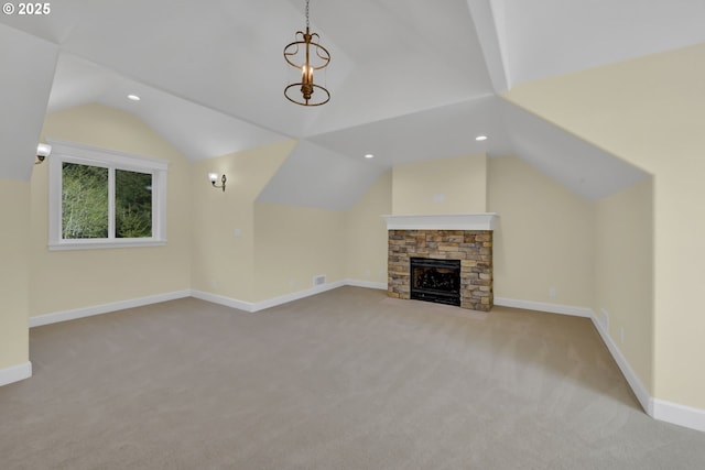 83594 Sauter Dr, Florence, OR 97439 - unfurnished living room with vaulted ceiling, carpet floors, recessed lighting, baseboards, and a fireplace