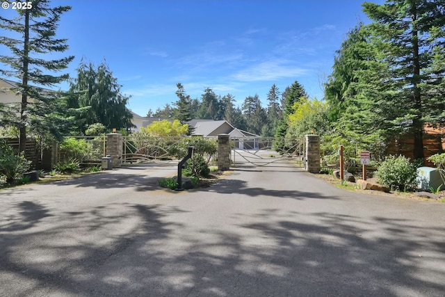 83594 Sauter Dr, Florence, OR 97439 - view of asphalt road featuring a gate and a gated entry