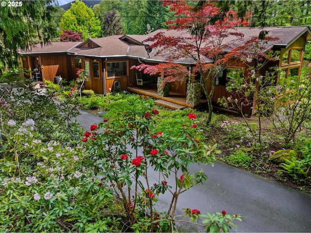 24880 E Arrah Wanna Blvd, Welches, OR 97067 - view of front of house featuring a wooden deck and board and batten siding