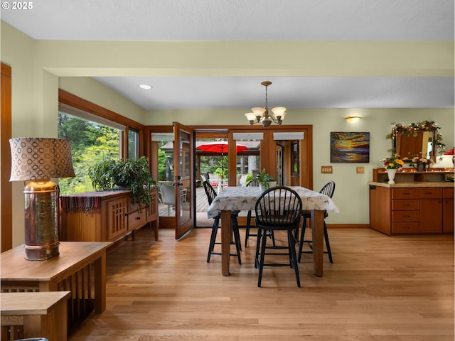 24880 E Arrah Wanna Blvd, Welches, OR 97067 - dining area featuring a chandelier, light wood-style floors, baseboards, and recessed lighting