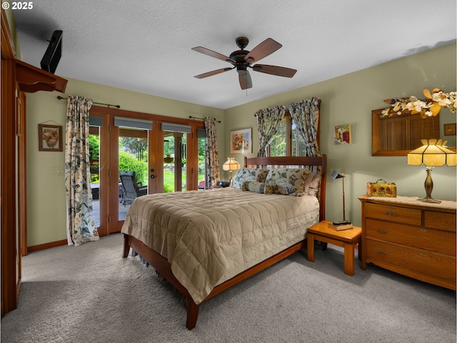 24880 E Arrah Wanna Blvd, Welches, OR 97067 - carpeted bedroom with access to exterior, ceiling fan, and baseboards