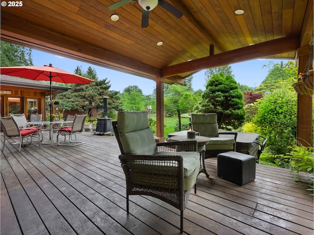 24880 E Arrah Wanna Blvd, Welches, OR 97067 - wooden terrace with outdoor dining area and a ceiling fan