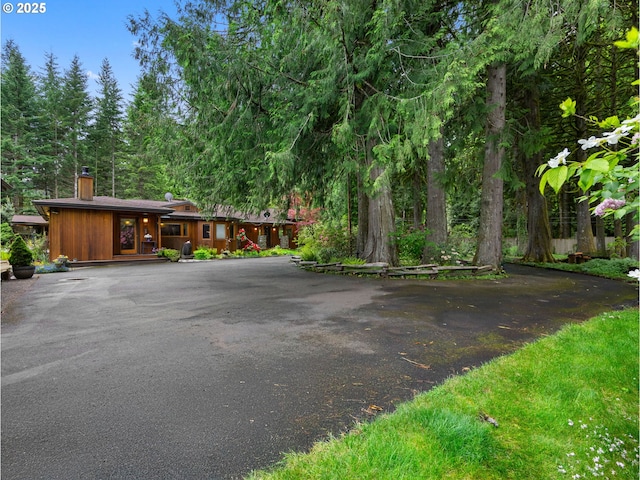 24880 E Arrah Wanna Blvd, Welches, OR 97067 - view of front of property featuring a chimney and driveway