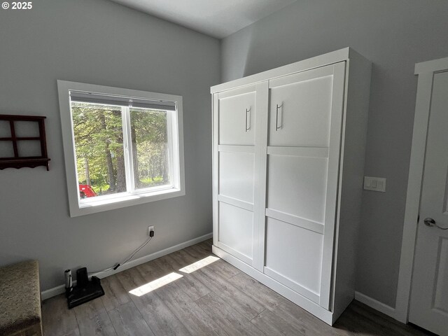 78115 Giger Ln, Weston, OR 97886 - unfurnished bedroom featuring wood finished floors and baseboards