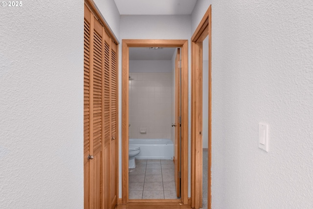 corridor featuring tile patterned flooring