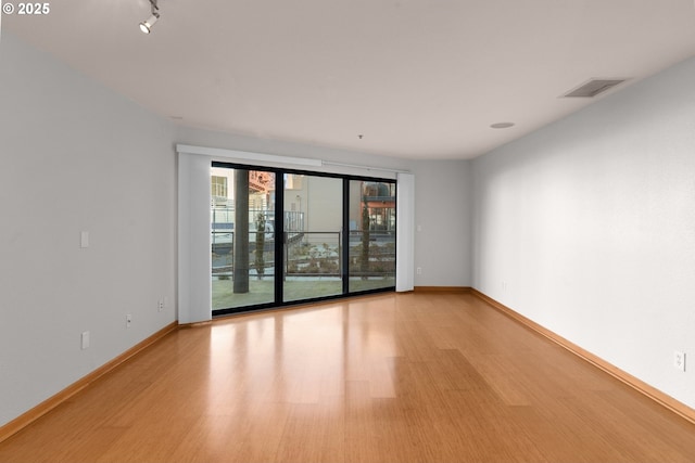 unfurnished room featuring light hardwood / wood-style flooring