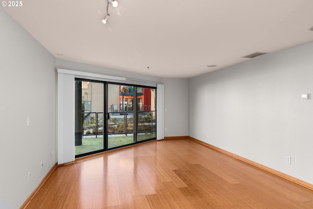 empty room featuring light hardwood / wood-style floors