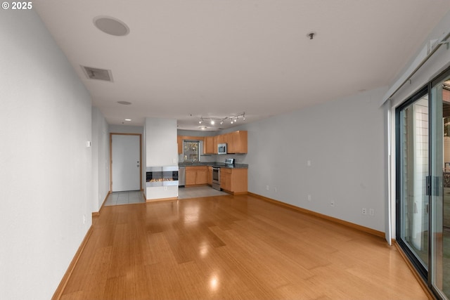 unfurnished living room featuring light hardwood / wood-style floors