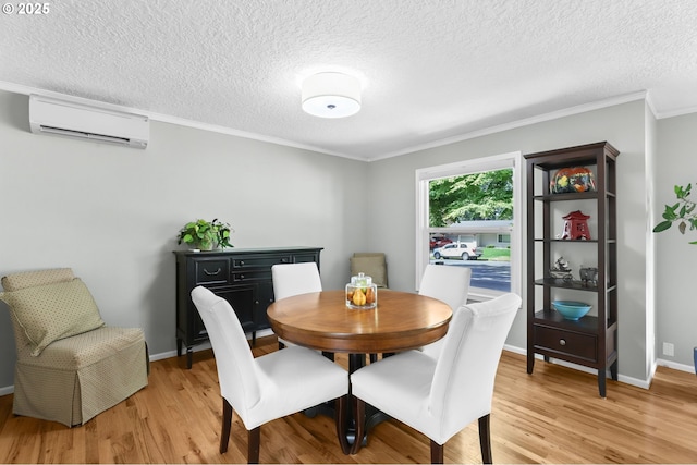 819 SE 98th Ave, Vancouver, WA 98664 - dining area featuring an AC wall unit, light wood-type flooring, a textured ceiling, and crown molding