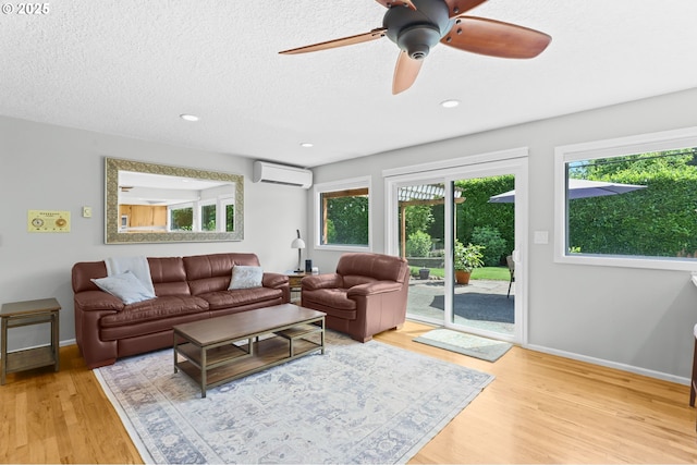 819 SE 98th Ave, Vancouver, WA 98664 - living area with an AC wall unit, wood finished floors, ceiling fan, a textured ceiling, and recessed lighting