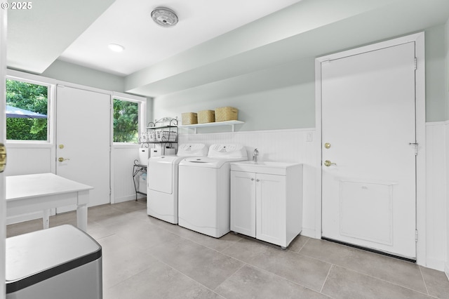 819 SE 98th Ave, Vancouver, WA 98664 - laundry area featuring cabinet space, washer and dryer, wainscoting, and light tile patterned flooring