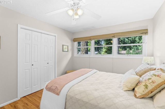 819 SE 98th Ave, Vancouver, WA 98664 - bedroom with multiple windows, wood finished floors, a closet, and a ceiling fan
