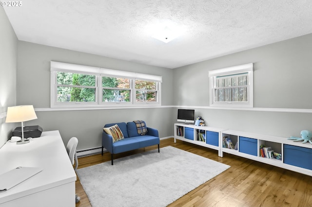 819 SE 98th Ave, Vancouver, WA 98664 - office space featuring wood finished floors, baseboard heating, and a textured ceiling