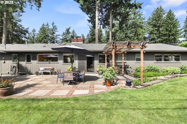819 SE 98th Ave, Vancouver, WA 98664 - back of house featuring a pergola, a patio, a chimney, a lawn, and a shingled roof