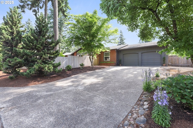 819 SE 98th Ave, Vancouver, WA 98664 - view of front of home featuring concrete driveway, a garage, and brick siding