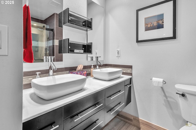 10795 SE 93rd Ct, Happy Valley, OR 97086 - full bathroom featuring double vanity, toilet, a shower stall, and baseboards