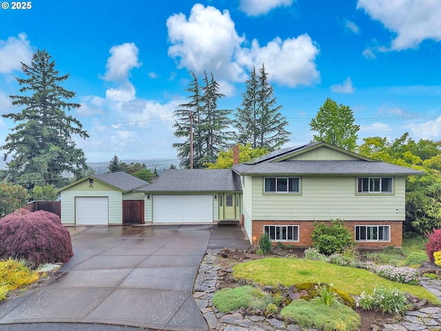 10795 SE 93rd Ct, Happy Valley, OR 97086 - split level home featuring concrete driveway and brick siding