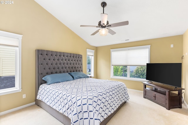 carpeted bedroom featuring vaulted ceiling and ceiling fan