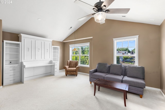 living room with vaulted ceiling, light colored carpet, and ceiling fan