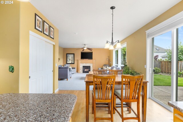 dining area featuring sink and light wood-type flooring