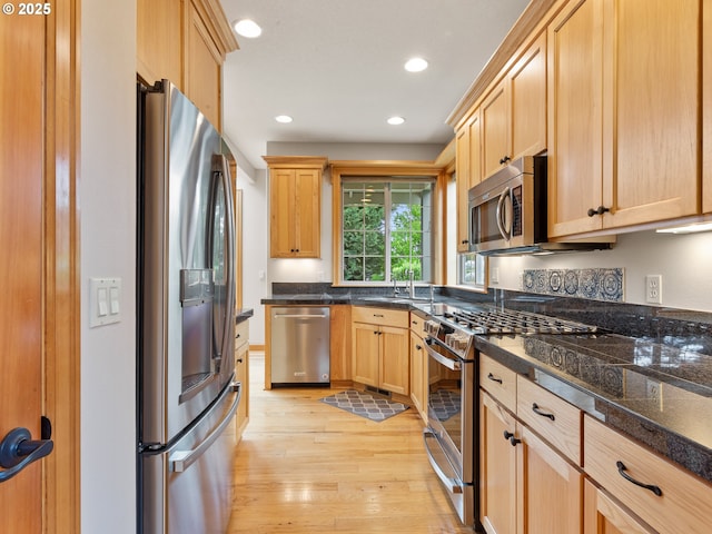 1466 NE 15th Ave, Canby, OR 97013 - kitchen featuring appliances with stainless steel finishes, light brown cabinetry, light wood-style floors, and recessed lighting