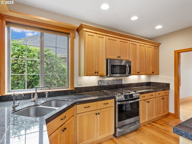 1466 NE 15th Ave, Canby, OR 97013 - kitchen with stainless steel appliances, tile counters, light wood-style floors, recessed lighting, and light brown cabinets