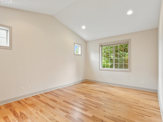 1466 NE 15th Ave, Canby, OR 97013 - empty room featuring vaulted ceiling, wood finished floors, and recessed lighting