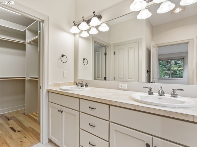 1466 NE 15th Ave, Canby, OR 97013 - bathroom with double vanity, wood finished floors, and a walk in closet