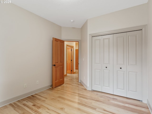 1466 NE 15th Ave, Canby, OR 97013 - unfurnished bedroom with light wood-style floors and a closet