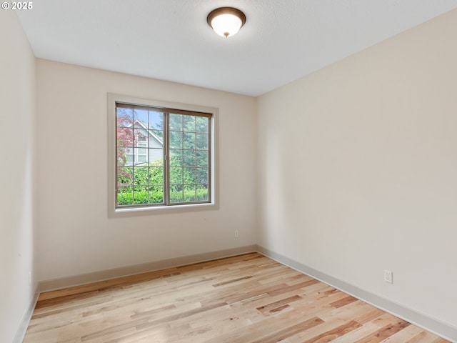 1466 NE 15th Ave, Canby, OR 97013 - empty room featuring wood finished floors and baseboards